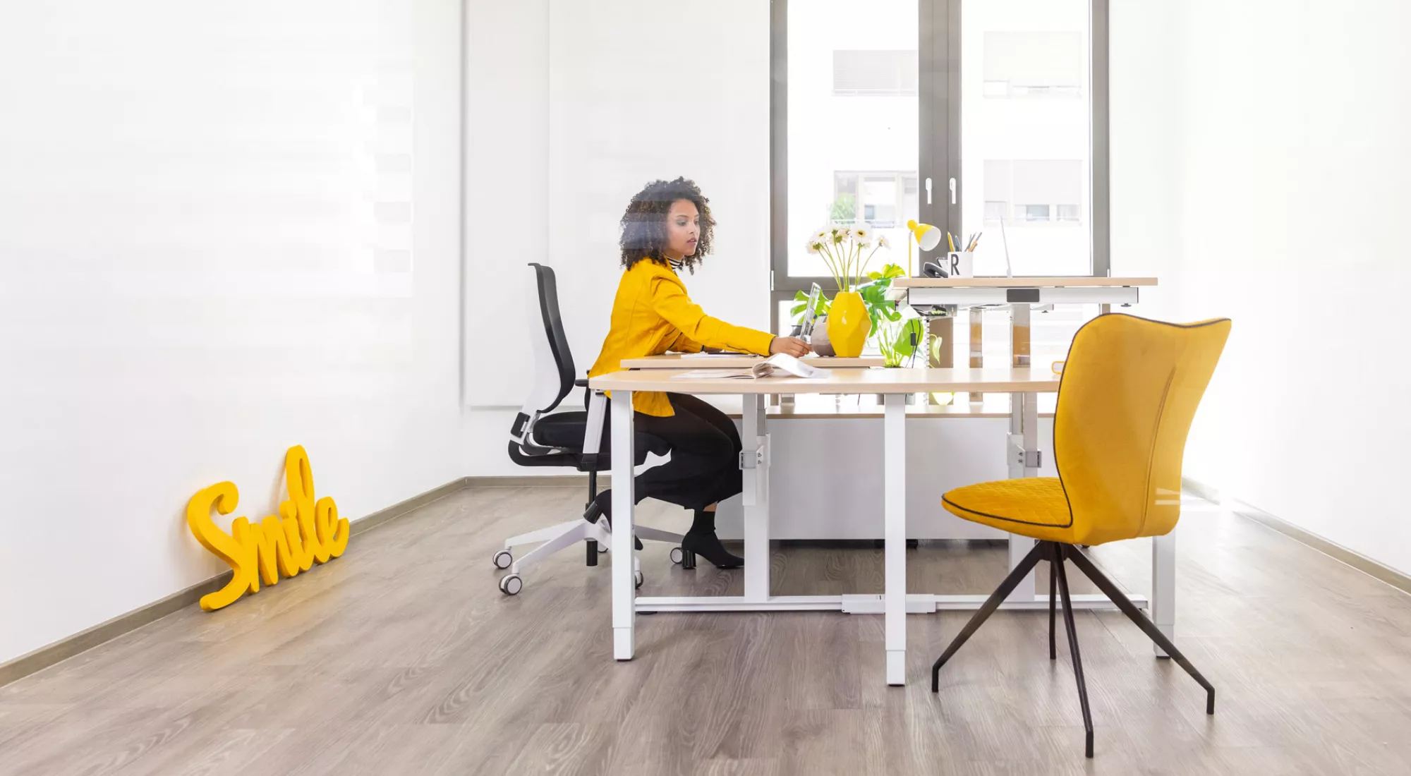 Woman sitting in front of REISS desk